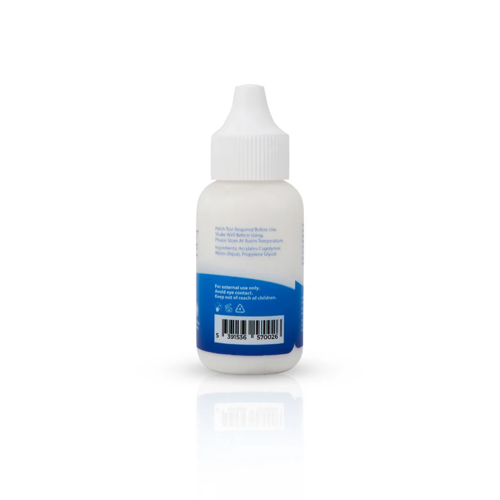 Small bottle with a white cap on a white background