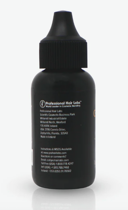 Black bottle with a label on a white background