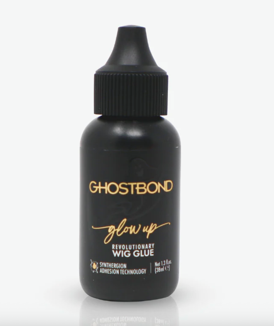 Black bottle of Ghostbond wig glue with gold text on a white background